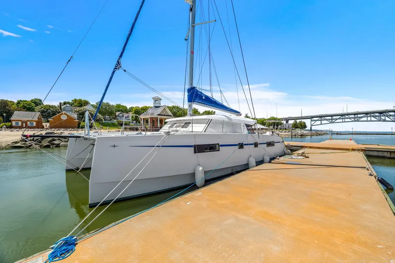 Vlaroda Yacht Photos Pics 2017 Nautitech 46 Open catamaran docked at a marina with clear blue skies.