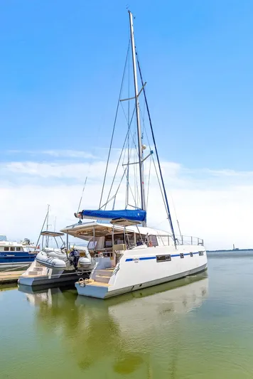 Vlaroda Yacht Photos Pics 2017 Nautitech 46 Open catamaran docked on calm water under clear blue sky.