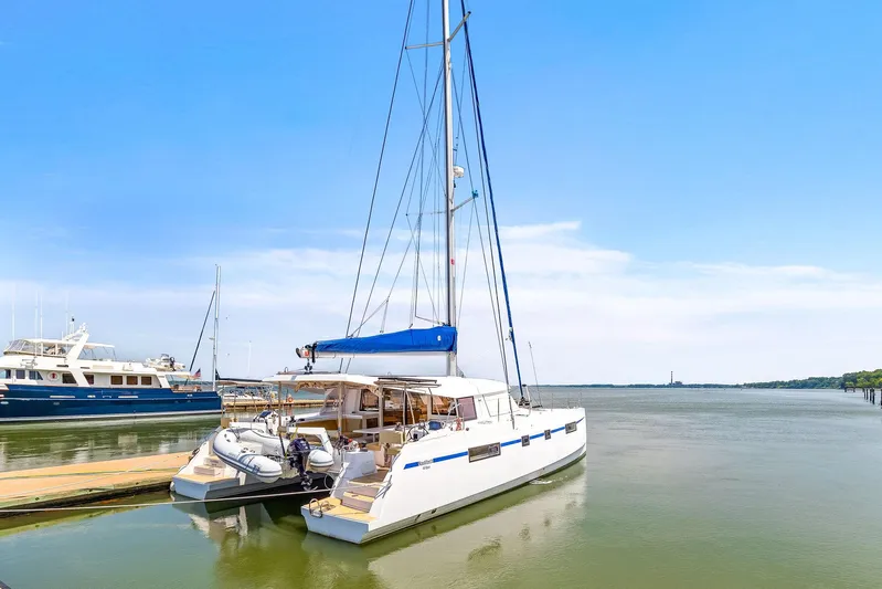 Vlaroda Yacht Photos Pics 2017 Nautitech 46 Open catamaran docked in serene marina setting.