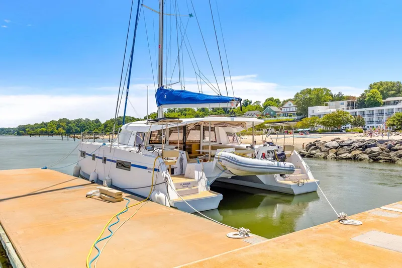 Vlaroda Yacht Photos Pics Nautitech 46 Open catamaran docked at a marina, 2017 model, with scenic waterfront view.