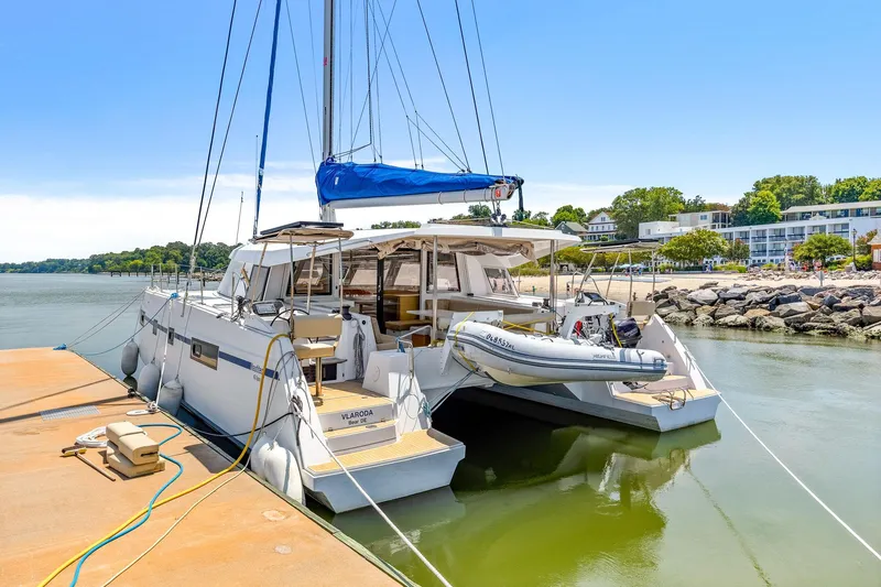 Vlaroda Yacht Photos Pics 2017 Nautitech 46 Open catamaran docked by a scenic shoreline.