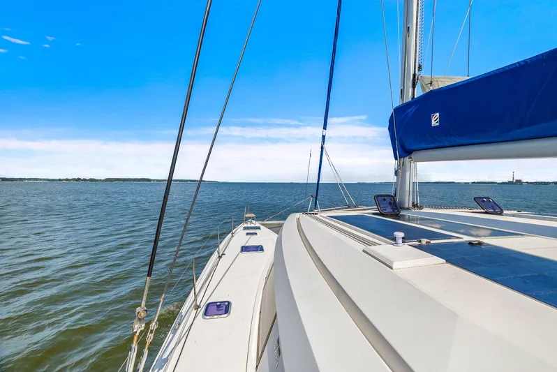 Vlaroda Yacht Photos Pics Sailing on a 2017 Nautitech 46 Open catamaran, clear blue skies, and calm waters.