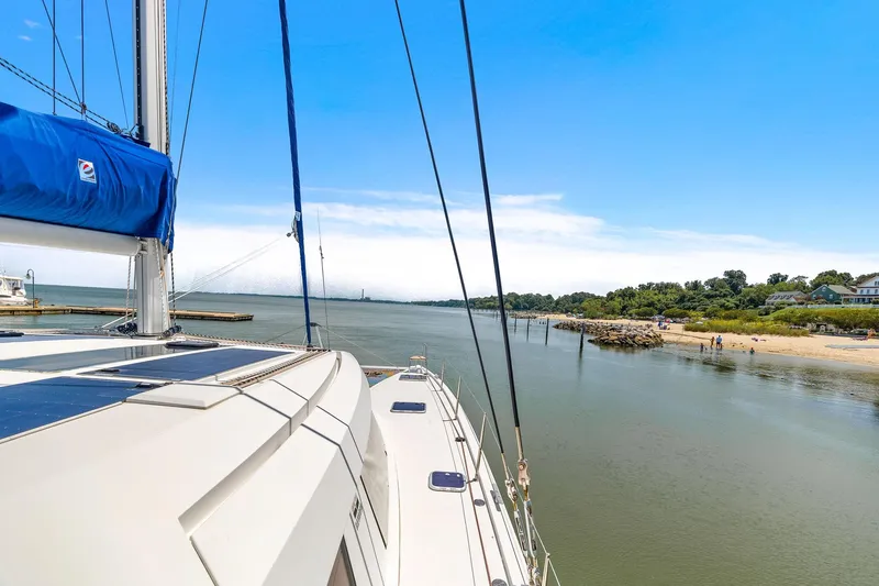 Vlaroda Yacht Photos Pics Nautitech 46 Open sailing near a scenic coastline, 2017 model.