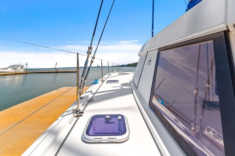 Vlaroda Yacht Photos Pics 2017 Nautitech 46 Open catamaran docked at a marina under clear blue skies.