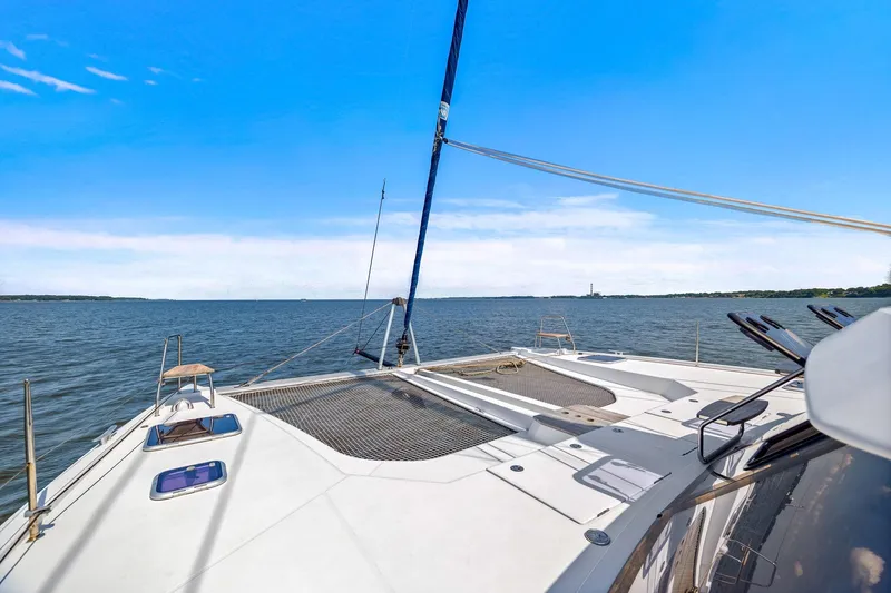 Vlaroda Yacht Photos Pics 2017 Nautitech 46 Open catamaran sailing on open water under clear blue skies.