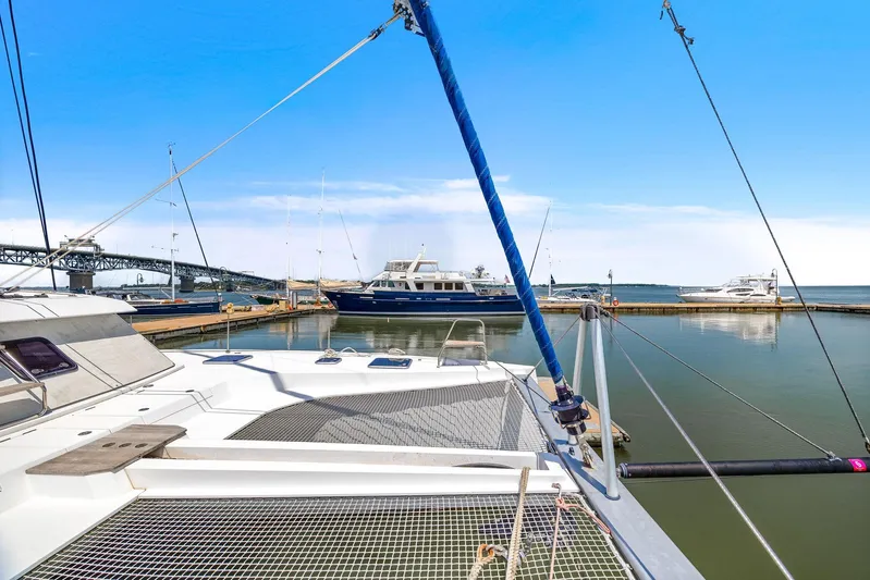 Vlaroda Yacht Photos Pics Nautitech 46 Open catamaran docked in a marina, 2017 model, with clear blue sky.