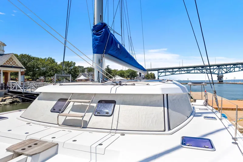Vlaroda Yacht Photos Pics 2017 Nautitech 46 Open catamaran docked near a bridge, clear sky background.