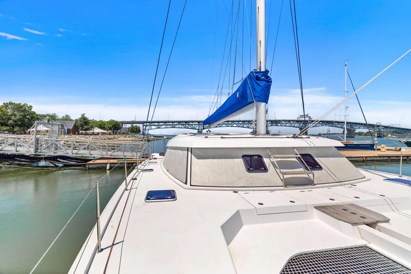 Vlaroda Yacht Photos Pics 2017 Nautitech 46 Open catamaran docked, featuring sleek design and spacious deck.