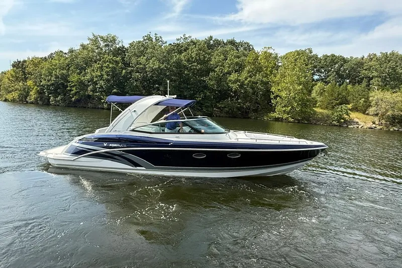  Yacht Photos Pics 2018 Formula 330 Crossover Bowrider cruising on a scenic lake.