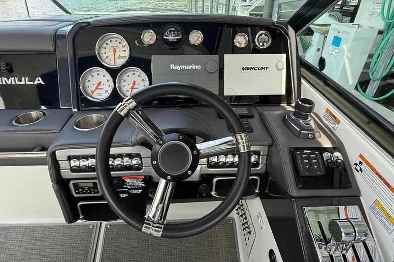  Yacht Photos Pics 2018 Formula 330 Crossover Bowrider dashboard with steering wheel and control panels.