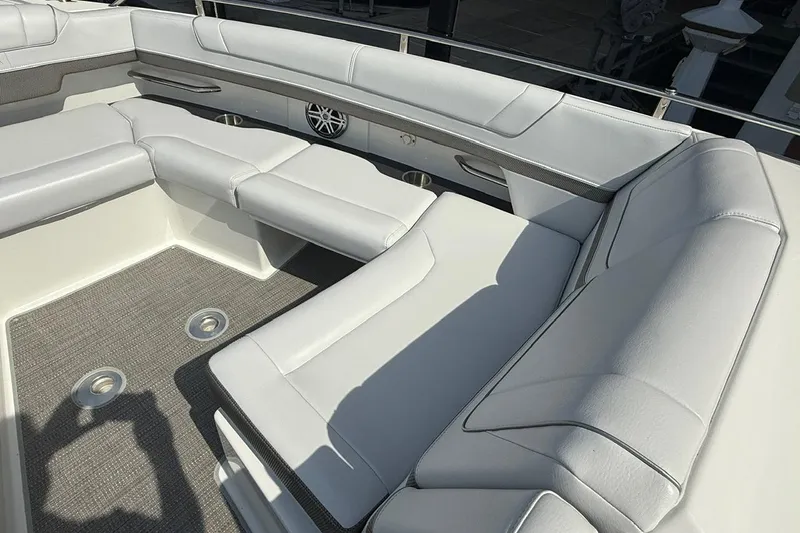  Yacht Photos Pics 2018 Formula 330 Crossover Bowrider interior with white cushioned seating and carpeted floor.