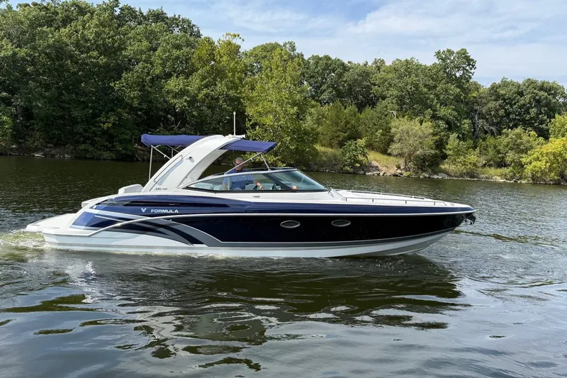  Yacht Photos Pics 2018 Formula 330 Crossover Bowrider cruising on a scenic lake.