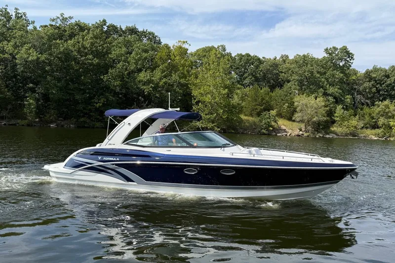 Yacht Photos Pics 2018 Formula 330 Crossover Bowrider cruising on a scenic lake.