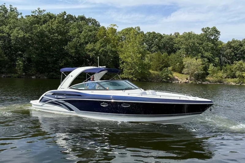  Yacht Photos Pics 2018 Formula 330 Crossover Bowrider cruising on a scenic lake.