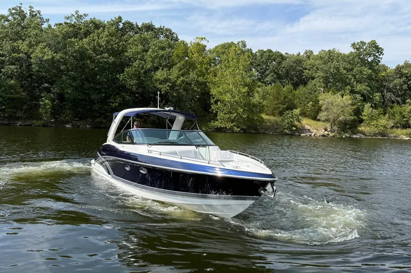  Yacht Photos Pics 2018 Formula 330 Crossover Bowrider cruising on a scenic lake.