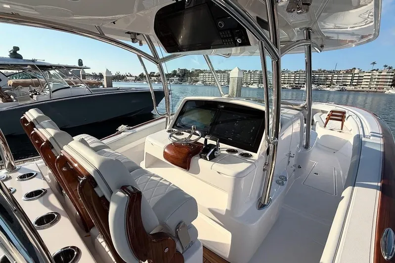  Yacht Photos Pics 2026 Mag Bay 38 CC boat interior with sleek console and luxurious seating.