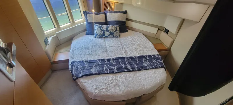  Yacht Photos Pics Luxurious bedroom interior of 2013 Azimut 45 Flybridge yacht with large windows and elegant bedding.