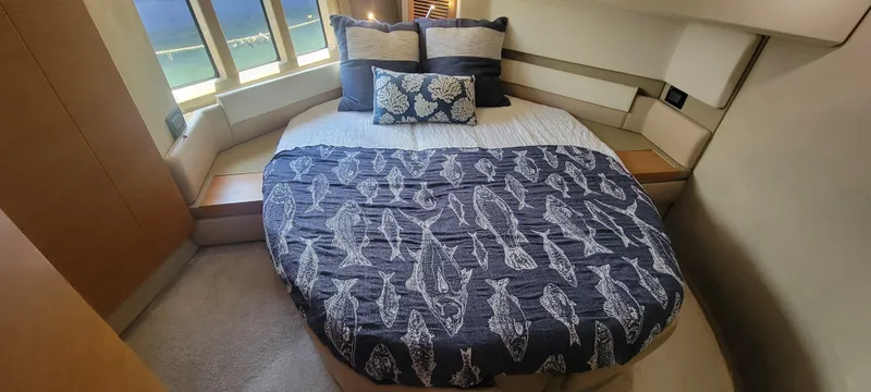  Yacht Photos Pics Luxurious bedroom in 2013 Azimut 45 Flybridge yacht with nautical-themed bedding.