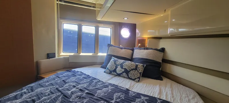  Yacht Photos Pics Luxurious bedroom interior of 2013 Azimut 45 Flybridge yacht with cozy bedding.