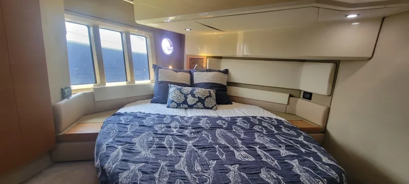  Yacht Photos Pics Luxurious bedroom interior of 2013 Azimut 45 Flybridge yacht with large bed and windows.
