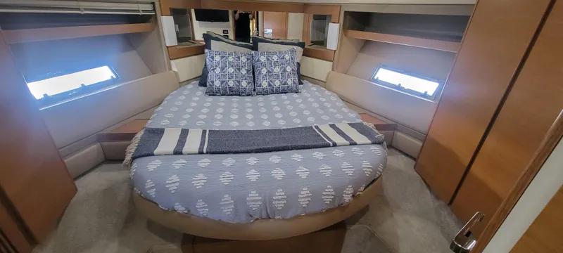  Yacht Photos Pics Luxurious bedroom in 2013 Azimut 45 Flybridge yacht with cozy bed and stylish decor.
