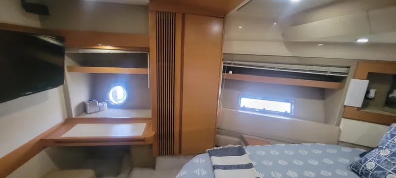  Yacht Photos Pics Interior cabin of 2013 Azimut 45 Flybridge yacht with desk and bed.
