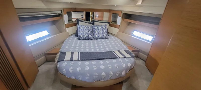  Yacht Photos Pics Luxurious bedroom interior of 2013 Azimut 45 Flybridge yacht with cozy bedding.