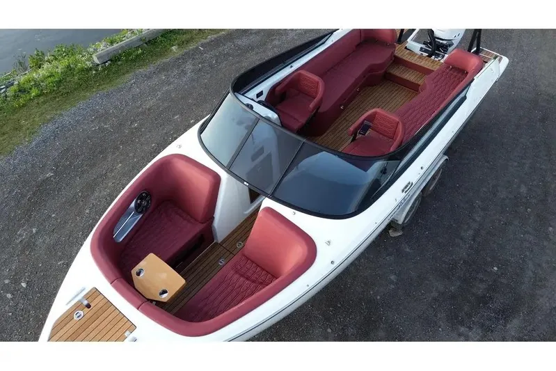  Yacht Photos Pics 2024 Cranchi E26 Classic boat with red interior and sleek design.