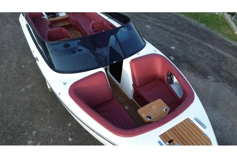  Yacht Photos Pics 2024 Cranchi E26 Classic boat with red seating and sleek design.