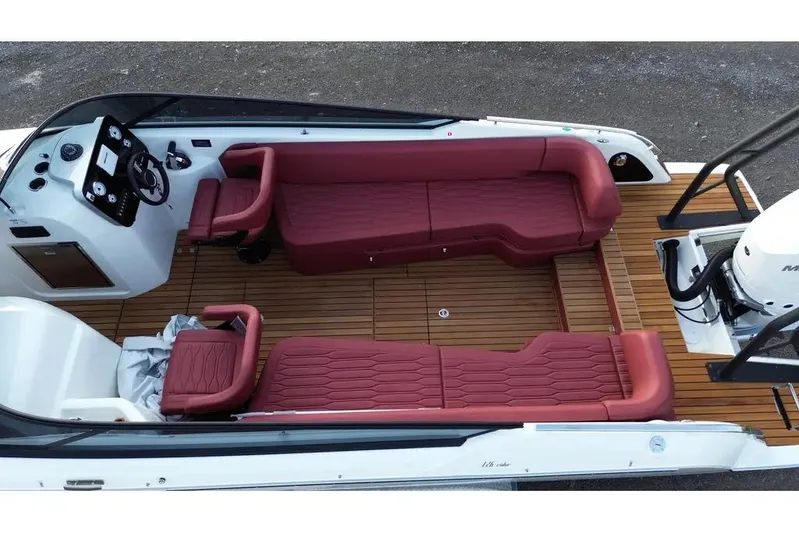  Yacht Photos Pics 2024 Cranchi E26 Classic boat interior with red seating and wooden deck.