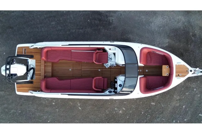  Yacht Photos Pics 2024 Cranchi E26 Classic boat, aerial view, featuring red seating and wooden deck.