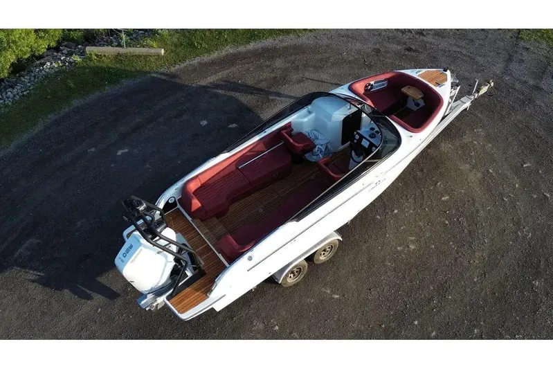  Yacht Photos Pics 2024 Cranchi E26 Classic boat with red interior, aerial view on a trailer.