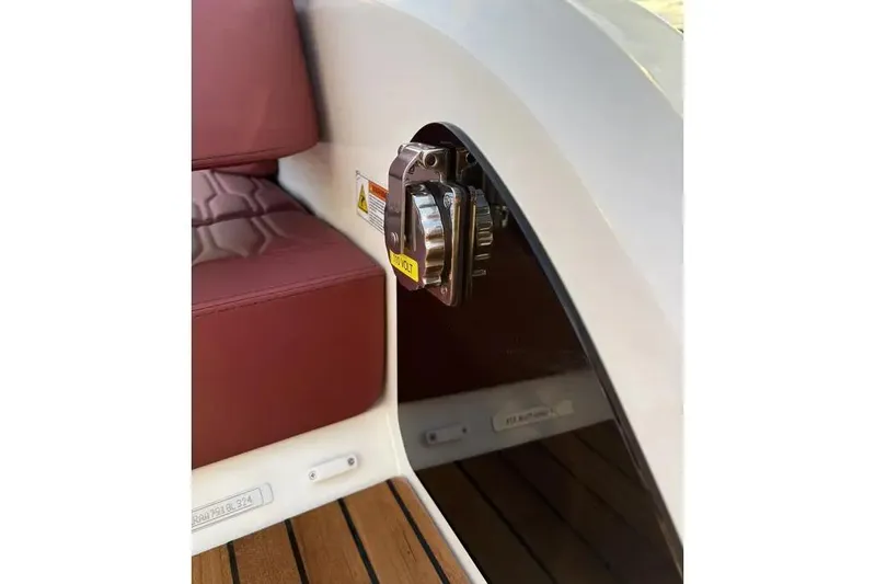  Yacht Photos Pics 2024 Cranchi E26 Classic interior detail with maroon seating and wooden flooring.