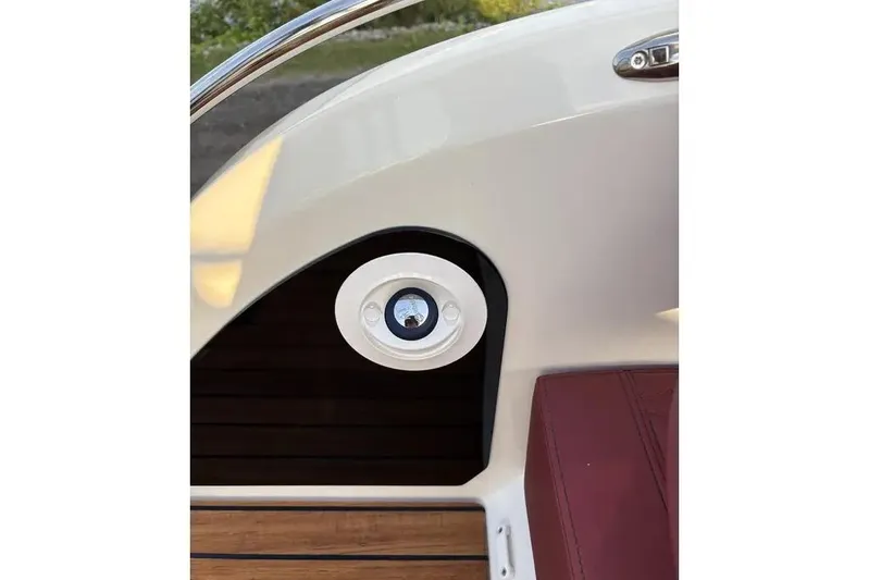  Yacht Photos Pics 2024 Cranchi E26 Classic boat interior detail with speaker and red seating.