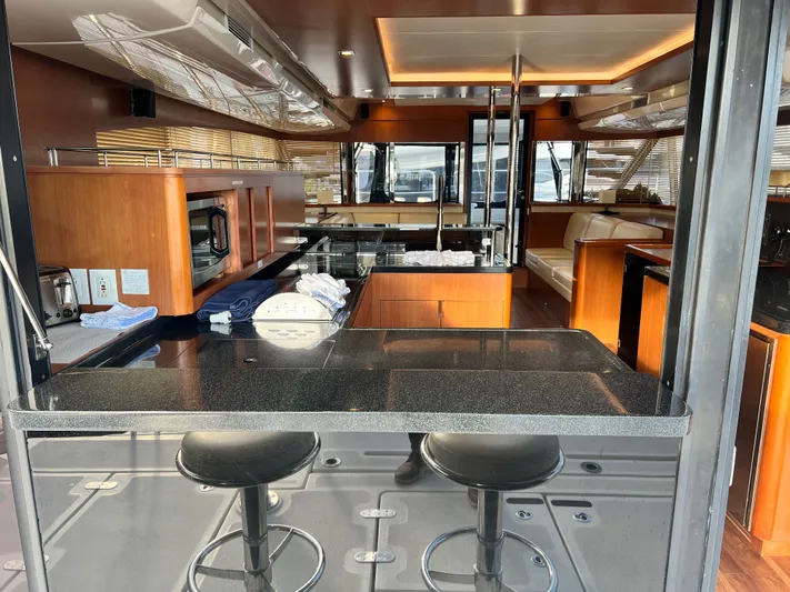 Yacht Photos Pics Luxurious interior of a 2016 Aquila 48 yacht with modern kitchen and seating area.