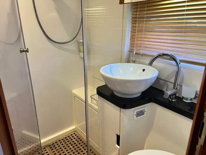  Yacht Photos Pics Modern bathroom in 2016 Aquila 48 yacht with vessel sink and glass shower.