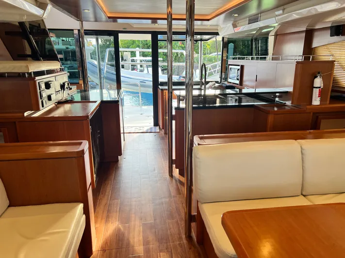  Yacht Photos Pics Luxurious interior of 2016 Aquila 48 yacht with modern kitchen and seating area.