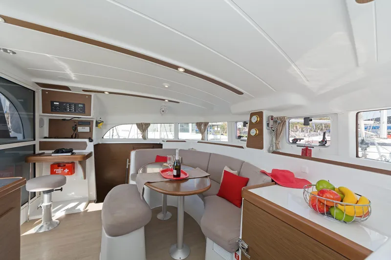  Yacht Photos Pics Interior of 2017 Lagoon 380 S2 catamaran with modern seating, dining area, and fruit basket.