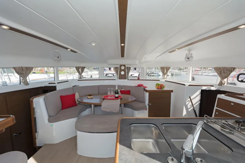  Yacht Photos Pics Interior of 2017 Lagoon 380 S2 catamaran with modern seating and dining area.