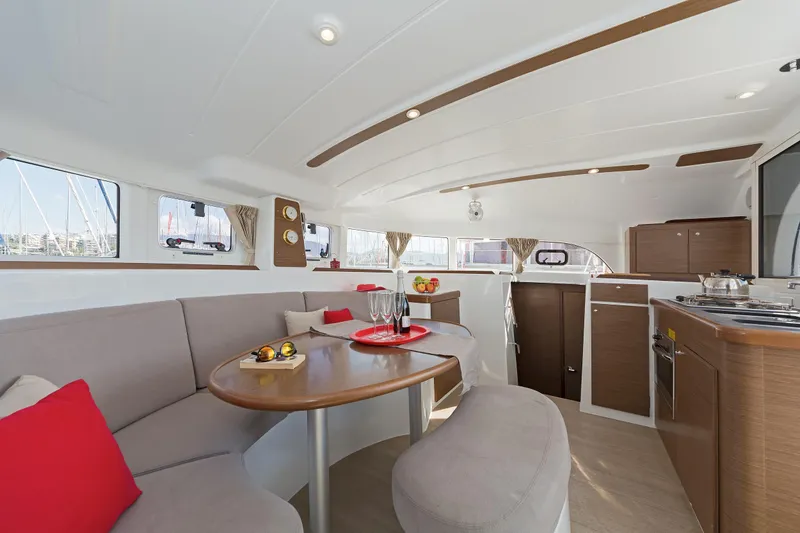  Yacht Photos Pics Interior of 2017 Lagoon 380 S2 catamaran with modern kitchen and cozy seating area.