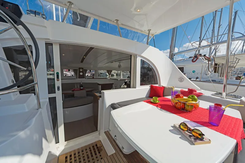  Yacht Photos Pics 2017 Lagoon 380 S2 yacht interior with dining area, fruit bowl, and vibrant decor.
