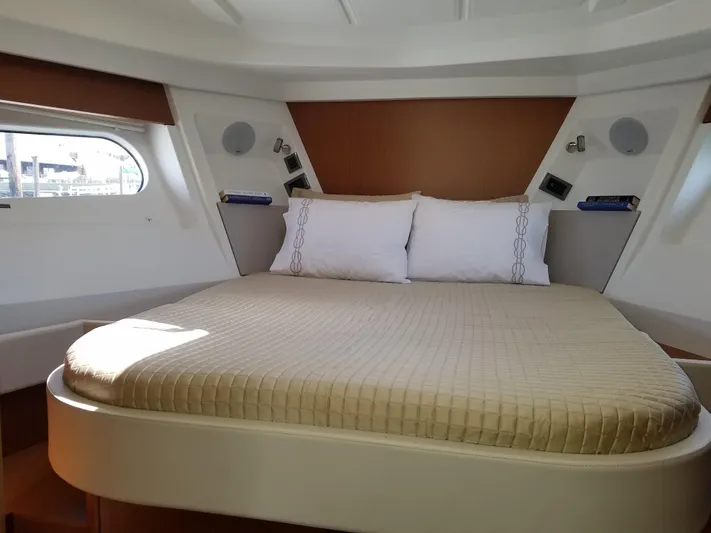  Yacht Photos Pics Luxurious bedroom in 2019 Beneteau Swift Trawler 35 with cozy bedding and modern design.