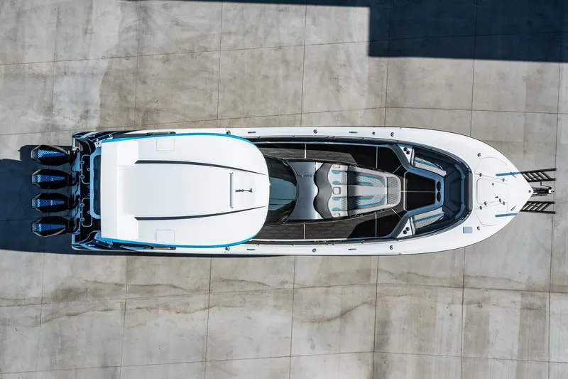  Yacht Photos Pics Aerial view of a 2023 MTI V42 speedboat on a concrete surface.