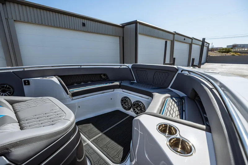  Yacht Photos Pics 2023 MTI V42 boat interior with seating and cup holders.