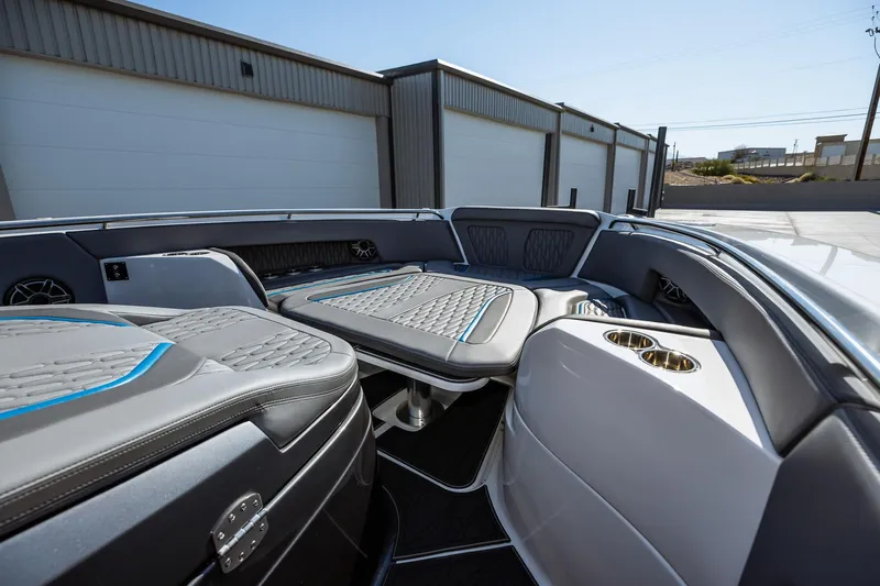  Yacht Photos Pics 2023 MTI V42 boat interior with luxurious seating and cup holders.