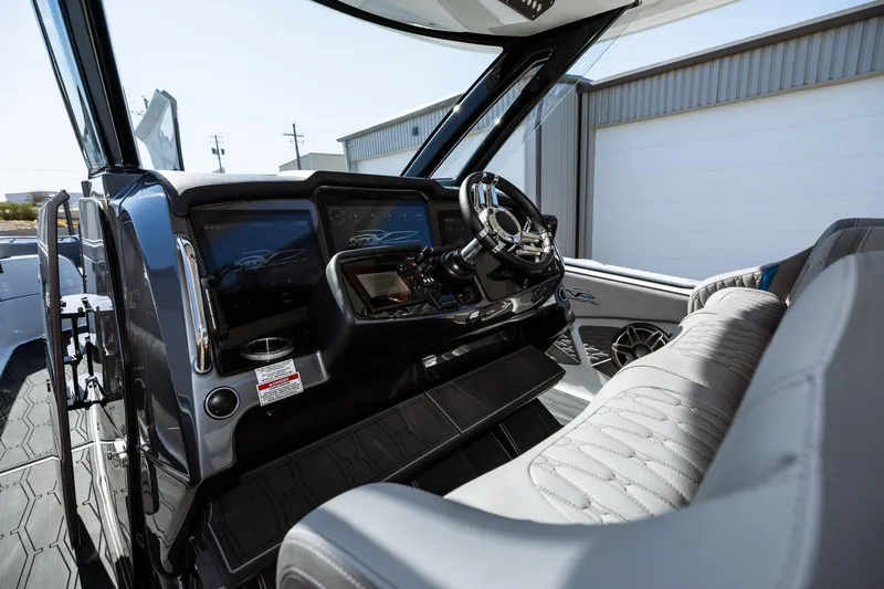  Yacht Photos Pics 2023 MTI V42 boat cockpit with modern controls and luxurious seating.