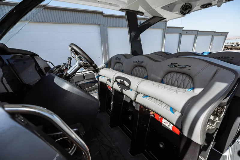  Yacht Photos Pics 2023 MTI V42 boat interior with modern seating and steering console.