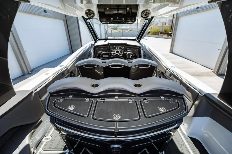  Yacht Photos Pics 2023 MTI V42 boat interior with luxurious seating and modern dashboard.