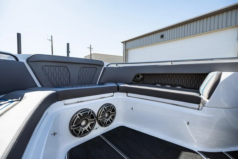  Yacht Photos Pics 2023 MTI V42 boat interior with cushioned seating and built-in speakers.