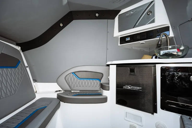  Yacht Photos Pics 2023 MTI V42 boat interior with modern seating and kitchenette.